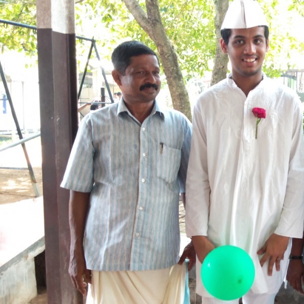 A dedicated volunteer shares a joyful moment with a Manovikas student during a school event, symbolizing support and inclusion.