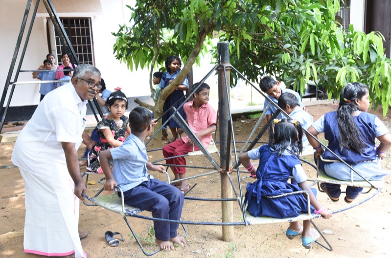 A joyful moment at Manovikas Special School, where Shri D. Jacob interacts with children as part of the DISHA Project.