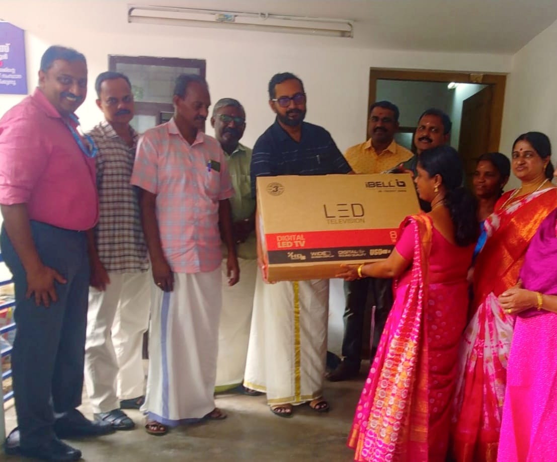 Representatives of Manovikas Centre, led by AEO Kulakkada, hand over a brand new LED TV to staff members of Puthur School as part of a CSR initiative to promote digital learning and inclusion.
