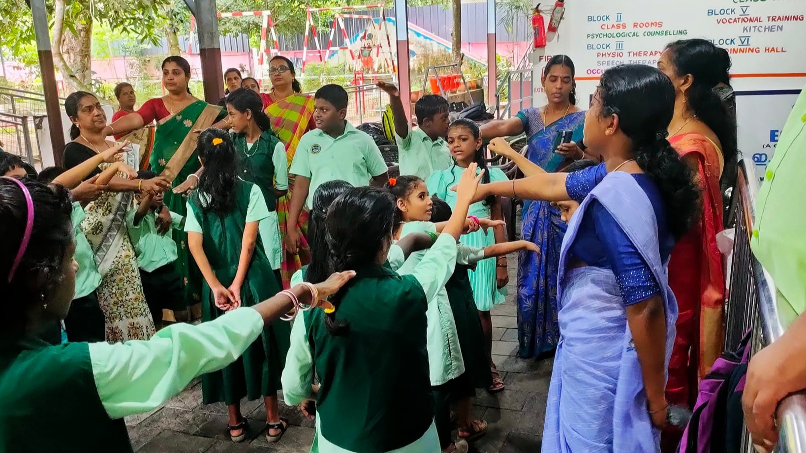 Students, guided by teachers and caregivers, take a solemn pledge to prevent dengue by maintaining cleanliness and eliminating stagnant water sources.
